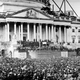 U.S. President Abraham Lincoln stands under cover at center of Capitol steps during his inauguration in Washington, D.C., on March 4, 1861. The scaffolding at upper right is used in construction of the Capitol dome.
